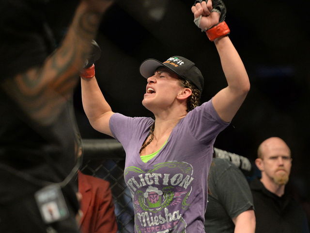 Miesha Tate chokes out Holly Holm to capture title at UFC 196