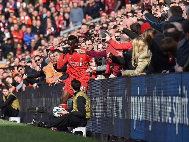 PHOTO: Supporters hold back Mario Balotelli after incident with Chris Smalling