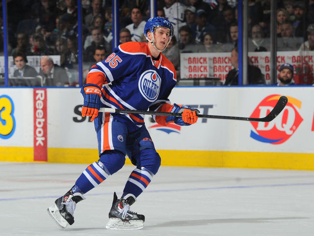 PHOTO: Oilers' Marincin, Miller cut puck in half after combining on milestone goal