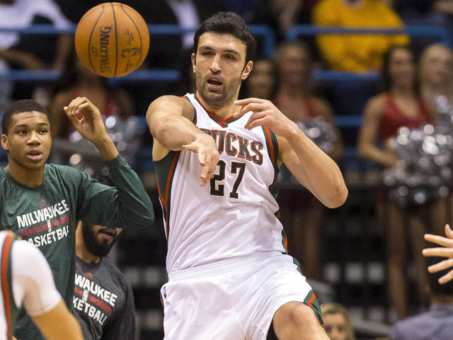 VIDEO: Bucks' Pachulia goes off glass to answer a couple prayers