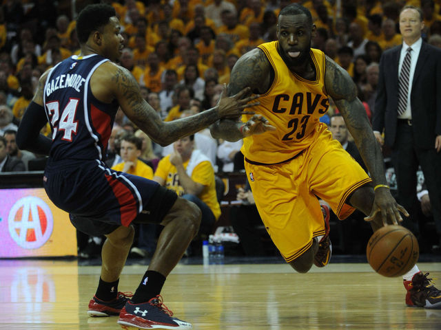LeBron's historic night helps Cavs edge Hawks in OT, take 3-0 series lead