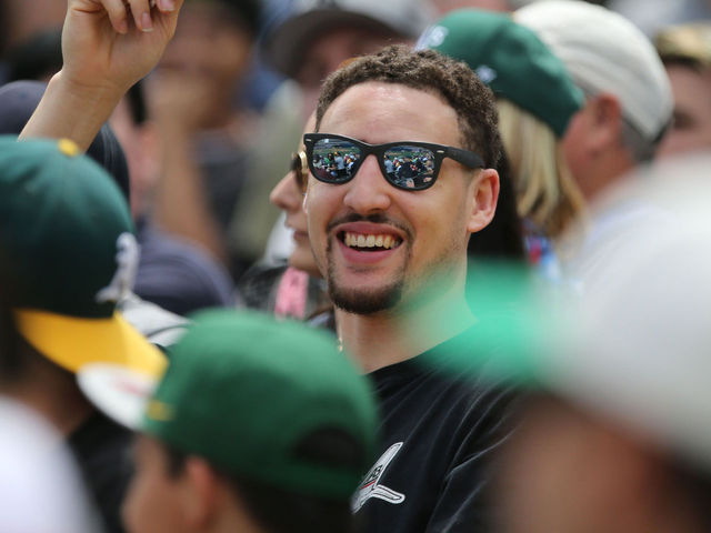 PHOTO: Klay Thompson takes in A's game, tight-lipped about practice Monday