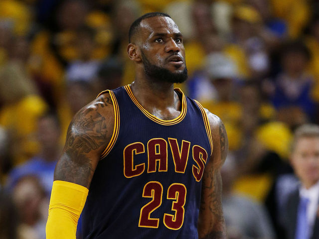 VIDEO: LeBron nails bank shot over two Warriors defenders