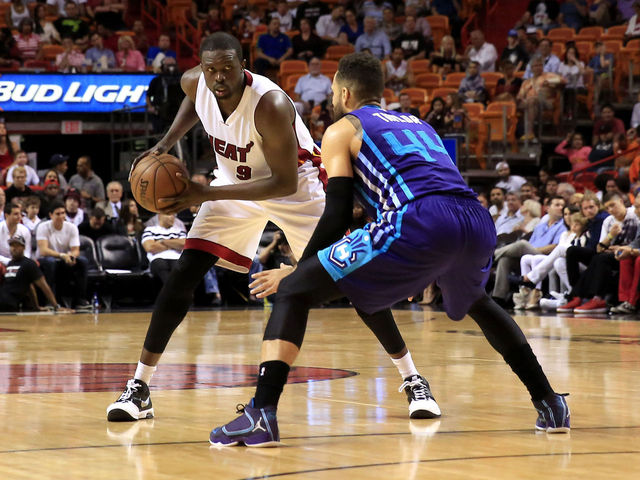 Heat's Deng opts in to last year of contract, to return for 2015-16