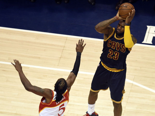 VIDEO: LeBron sinks seated sideline shot in Vegas