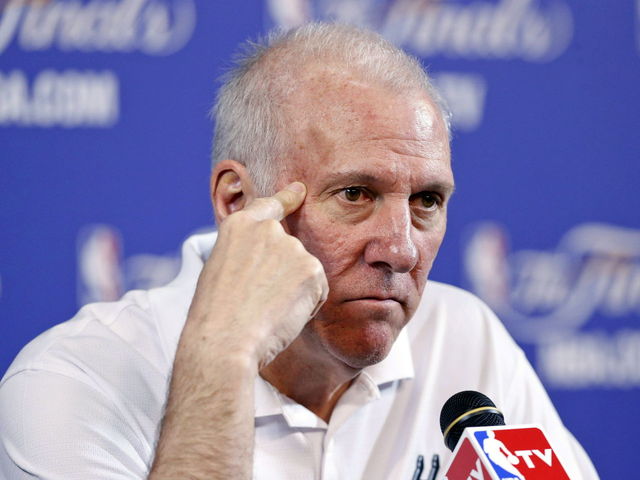 PHOTO: Popovich takes picture with Serbian fans, barely cracks a smile