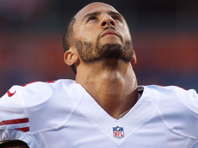 Kaepernick sits during national anthem