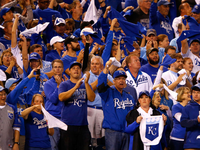 PHOTO: Fan who caught Moustakas HR says he didn't reach over wall
