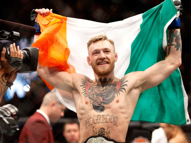 McGregor claims featherweight title with record-setting decimation of Aldo at UFC 194