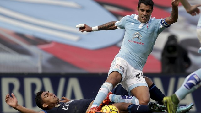 Atletico signs Celta midfielder Augusto Fernandez