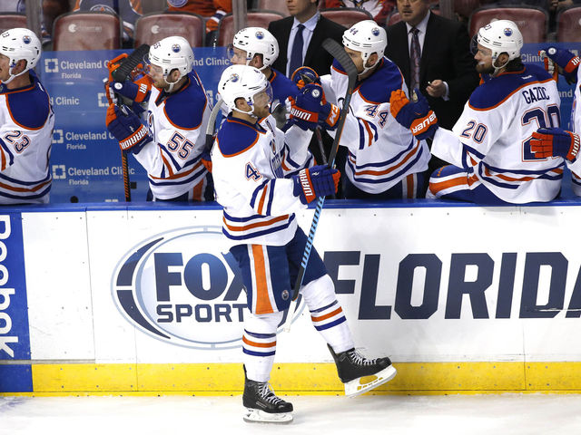 Hall's 3-point night paces Oilers to rare road victory