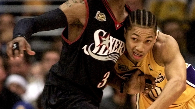PHOTO: Tyronn Lue steps over David Blatt in recreation of AI's moment