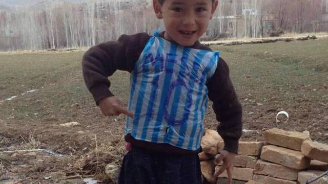PHOTO: Boy wearing plastic bag Messi jersey located in Afghanistan