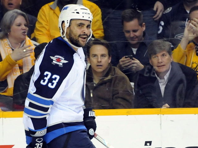 VIDEO: Jets' Byfuglien makes faces at camera mid-play