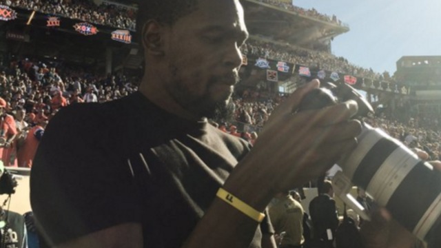 Kevin Durant works the sidelines as Super Bowl photographer