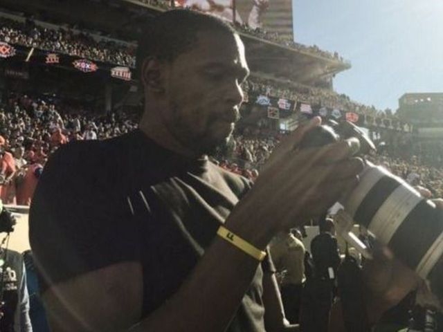 Kevin Durant works the sidelines as Super Bowl photographer