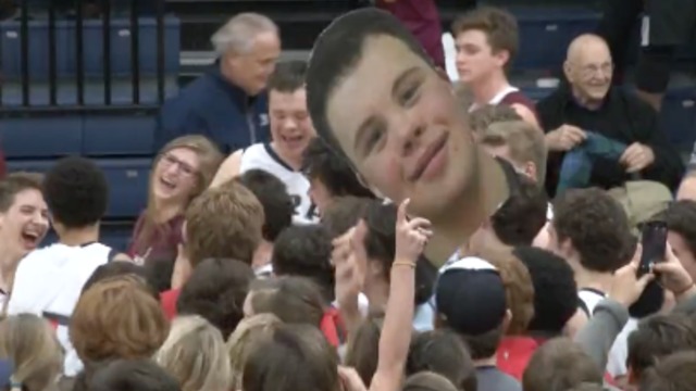VIDEO: Fans storm the court after senior with Down syndrome sinks 3