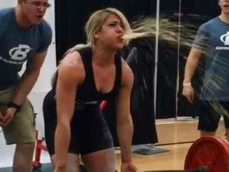 VIDEO Powerlifter loses her lunch on judges during competition