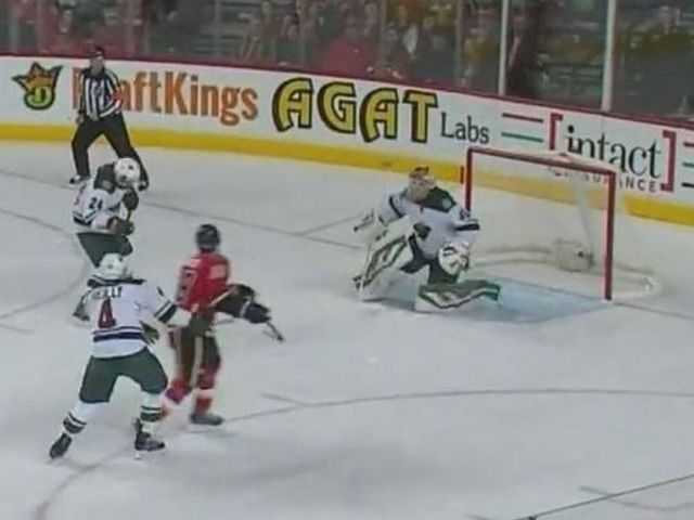 VIDEO: Flames' Jones scores as puck banks off Dumba's head, goes in net