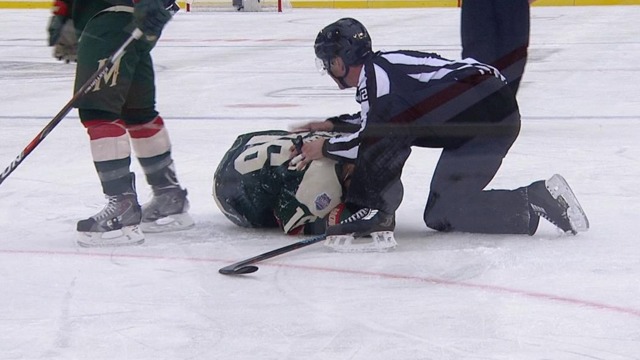 Blackhawks' Rozsival ejected for high hit on Wild's Zucker