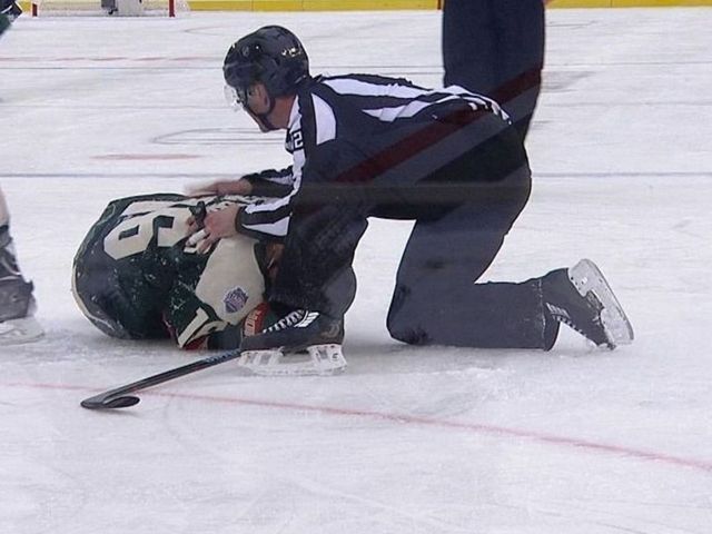 Blackhawks' Rozsival ejected for high hit on Wild's Zucker
