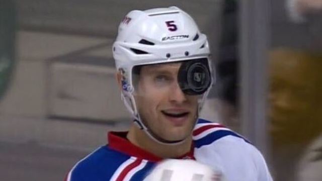 VIDEO: Puck somehow gets lodged behind Dan Girardi's visor