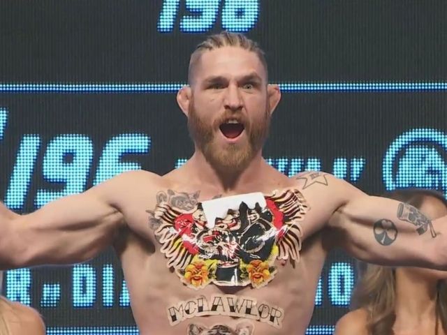 PHOTO: Tom Lawlor imitates Conor McGregor at UFC 196 weigh-ins