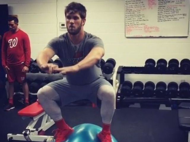 VIDEO: Harper squats while standing on exercise ball