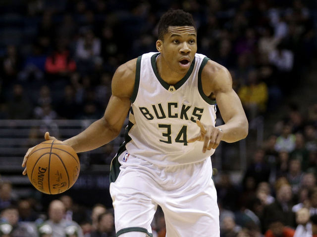 VIDEO: Giannis gets Larkin to bite on fake en route to slam dunk