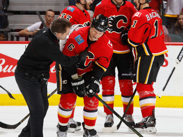 Flames' Wideman injured in post-goal collision