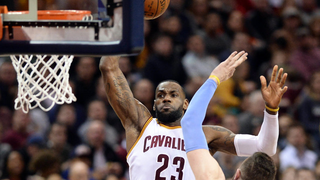 James notches 2nd triple-double as Cavs clinch Central