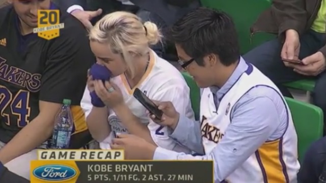 VIDEO: Lakers fans win tug of war over Kobe's arm sleeve; proceed to smell it
