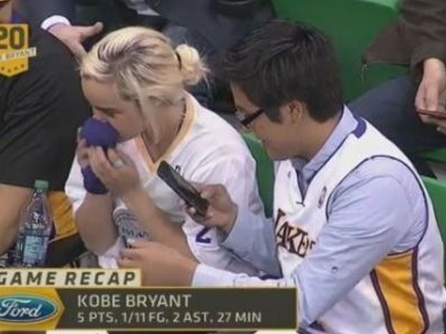 VIDEO: Lakers fans win tug of war over Kobe's arm sleeve; proceed to smell it