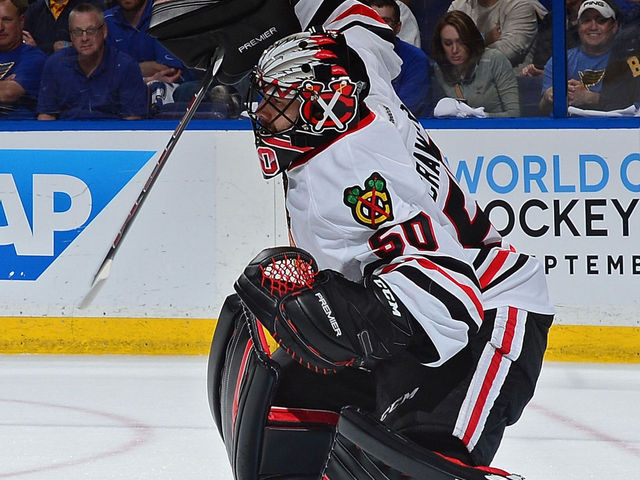 Crawford jumps Esposito for Blackhawks' playoff wins record