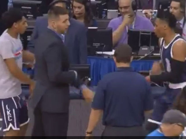 Thunder teammates stand guard while Westbrook and Payne dance