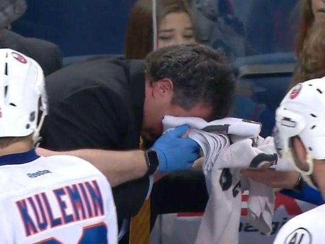 Islanders' coach Capuano takes puck to face