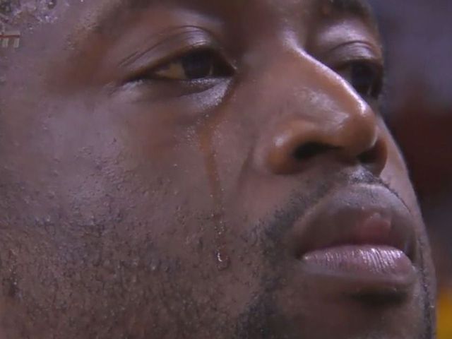 Wade says he was sweating, not crying during national anthem