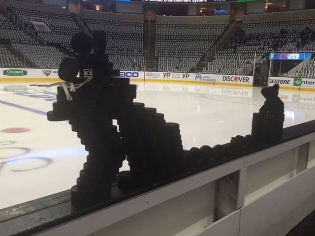Sharks' Game 2 black cat made of pucks