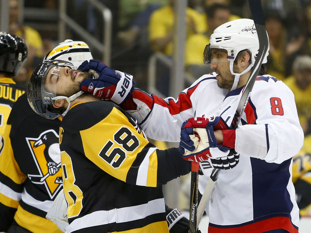 Watch: Letang whacked on head by leaping Backstrom