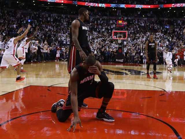 Wade crumbles to court following Lowry's half-court 3