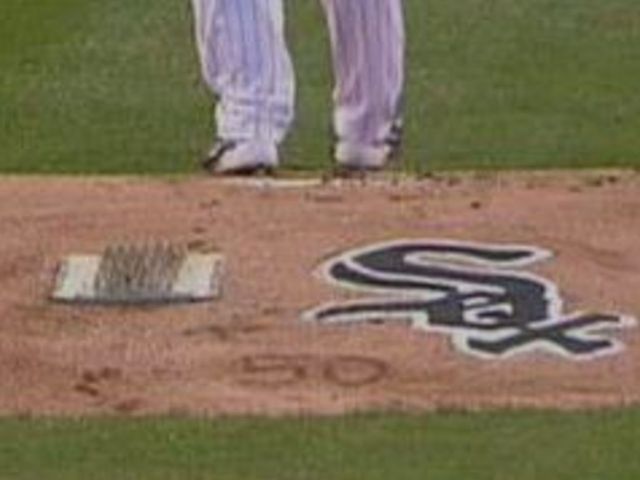 Carlos Rodon writes John Danks' number on mound