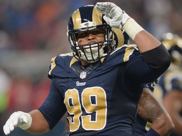 Rams' Donald ends holdout, reports to team absent new deal