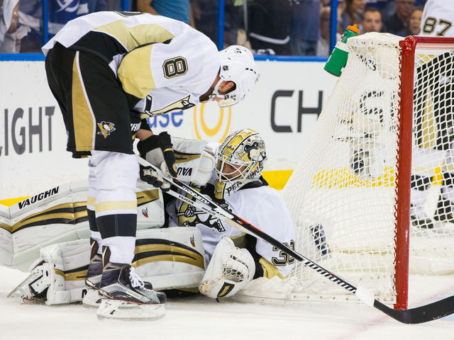 Penguins' Murray bumped behind net by teammate Dumoulin