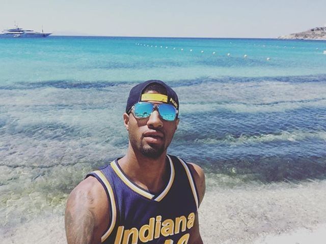 Paul George wears his own jersey while on vacation