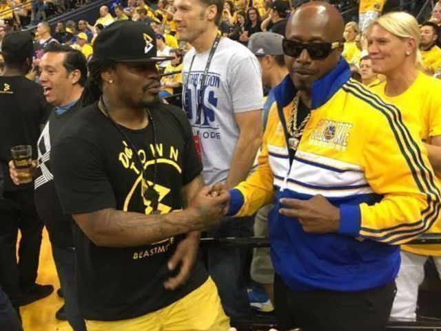 Marshawn Lynch catches up with MC Hammer at NBA Finals