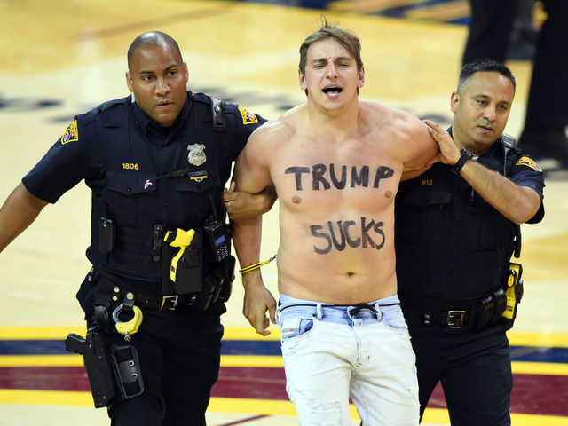 Fan rushes court with 'Trump Sucks' inscribed on chest
