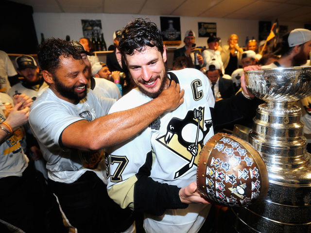 Another emotional Stanley Cup handoff as Crosby goes to Daley, Dupuis