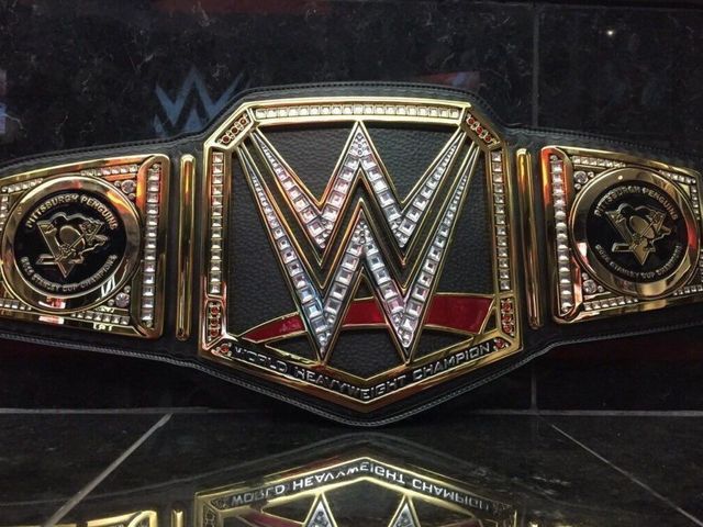 Triple H congratulates Penguins with custom WWE title belt