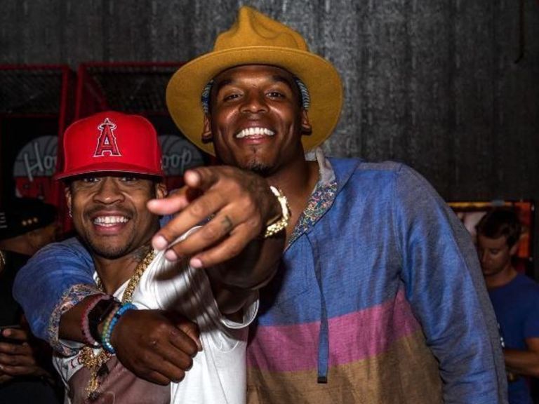 Cam Newton poses with Allen Iverson after charity kickball event
