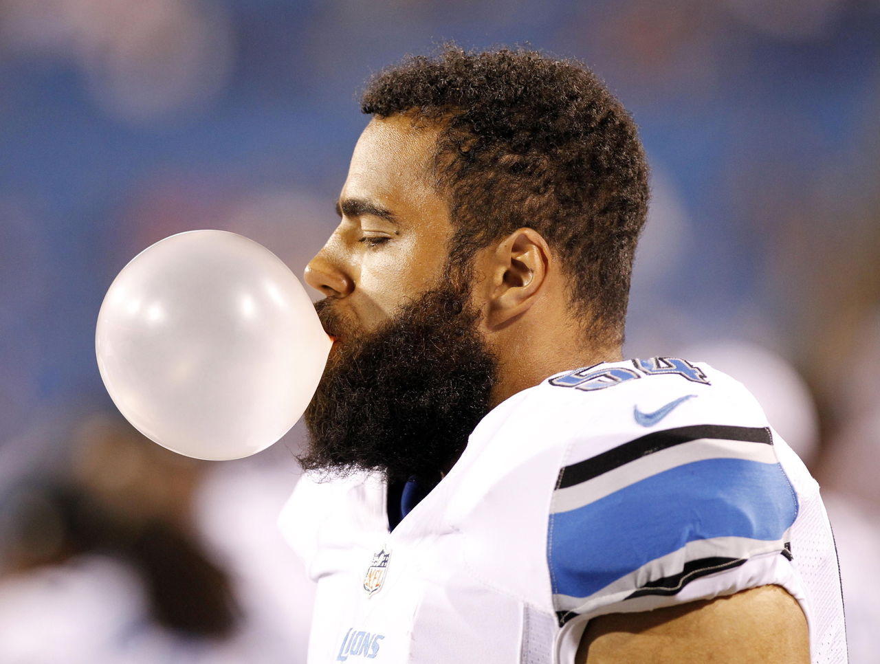 Detroit Lions linebacker Levy stands atop a plane